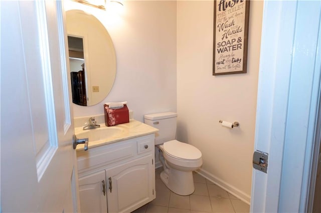 bathroom featuring vanity, toilet, and tile patterned floors