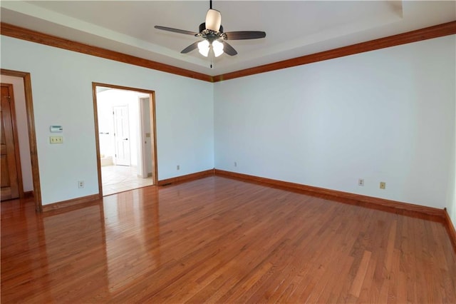 unfurnished room with crown molding, hardwood / wood-style flooring, and ceiling fan