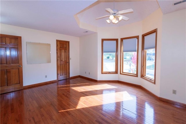 spare room featuring ceiling fan and light hardwood / wood-style flooring