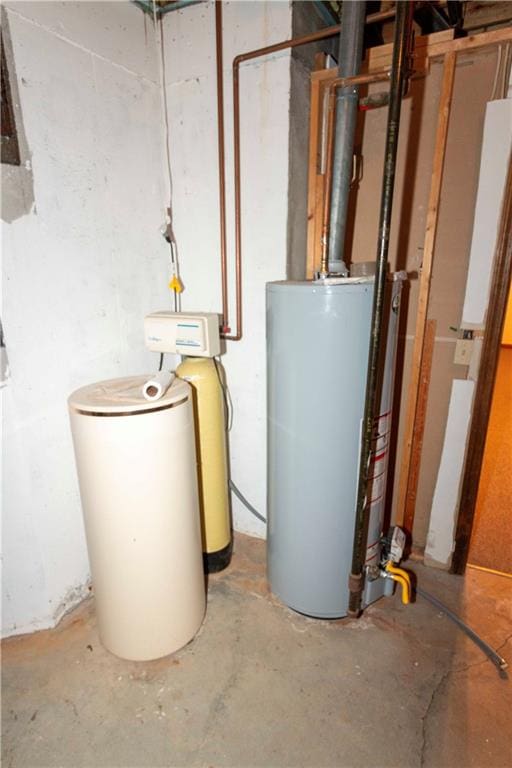 utility room featuring water heater