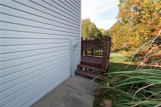 view of side of property with a wooden deck