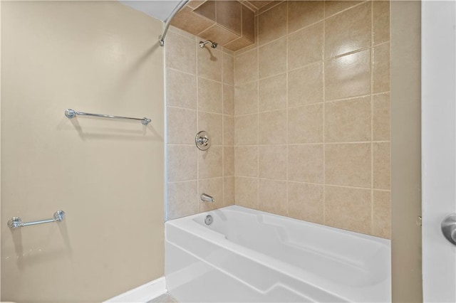 600 E Admiral Blvd Unit 704, Kansas City, MO 64106 - bathroom featuring shower / washtub combination and baseboards