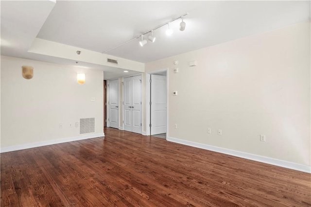 600 E Admiral Blvd Unit 704, Kansas City, MO 64106 - empty room with wood finished floors and rail lighting