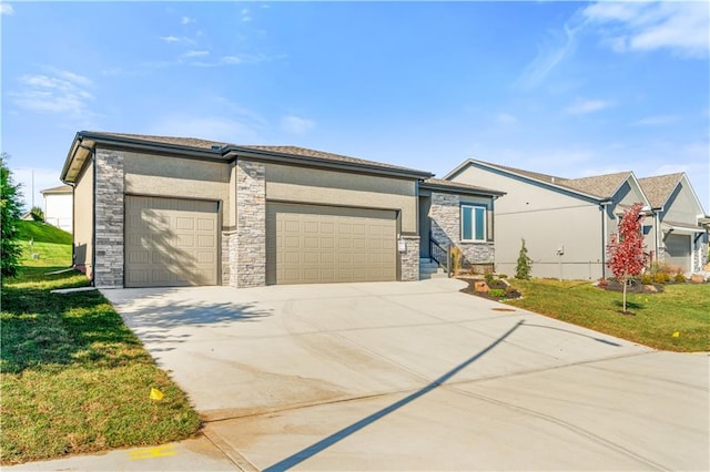 view of front of property with a front lawn and a garage