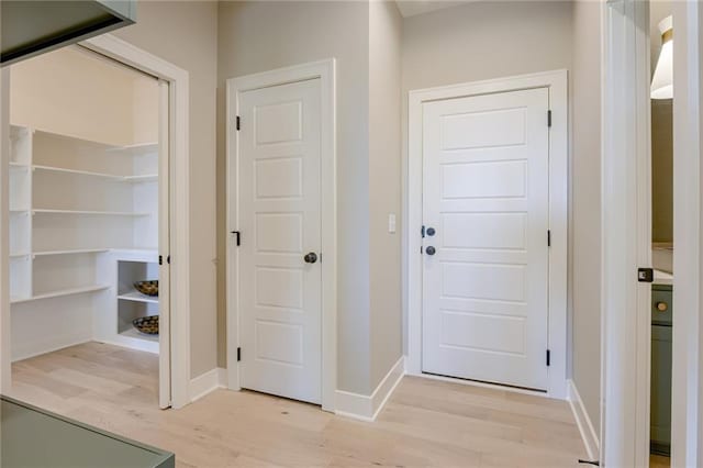 doorway with light hardwood / wood-style flooring