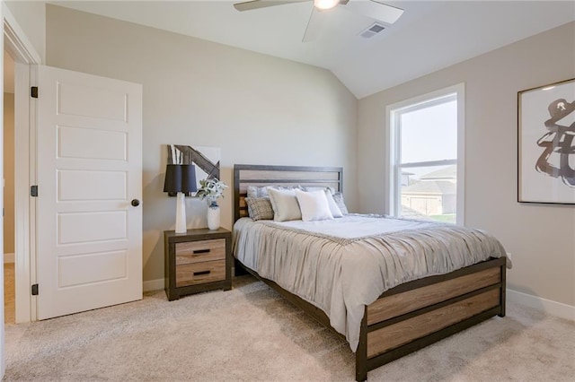 bedroom featuring light carpet, vaulted ceiling, and ceiling fan