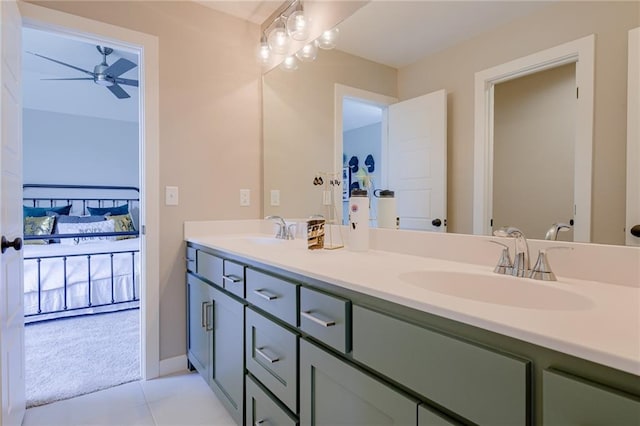 bathroom featuring tile patterned floors, ceiling fan, and vanity