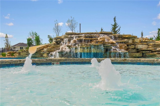 view of pool featuring pool water feature