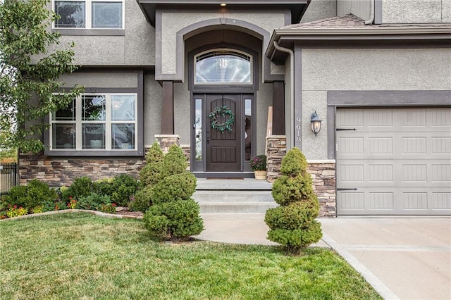 property entrance featuring a yard and a garage