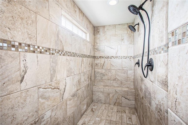 bathroom with a tile shower