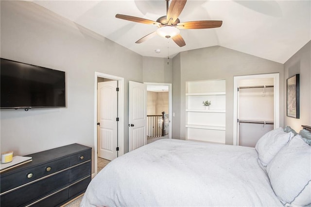 carpeted bedroom with vaulted ceiling and ceiling fan