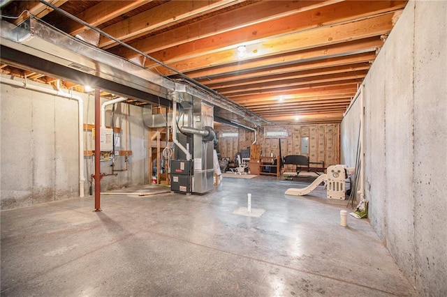 basement featuring heating unit