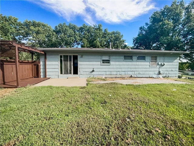 back of property with fence, a yard, a patio area, and a pergola