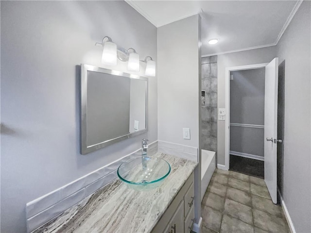 bathroom featuring vanity, baseboards, and ornamental molding