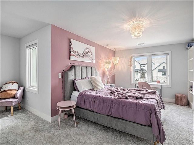 carpeted bedroom featuring multiple windows