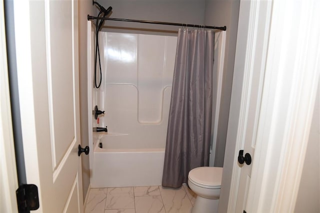 full bathroom with marble finish floor, shower / tub combo, and toilet