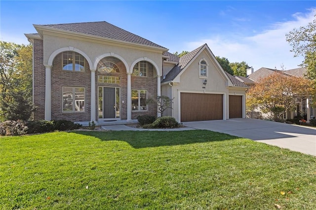 view of front facade featuring a front lawn and a garage