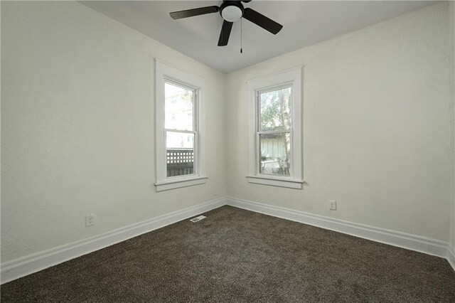 carpeted empty room with ceiling fan