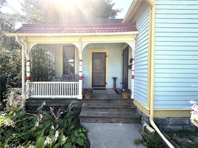 doorway to property featuring a porch