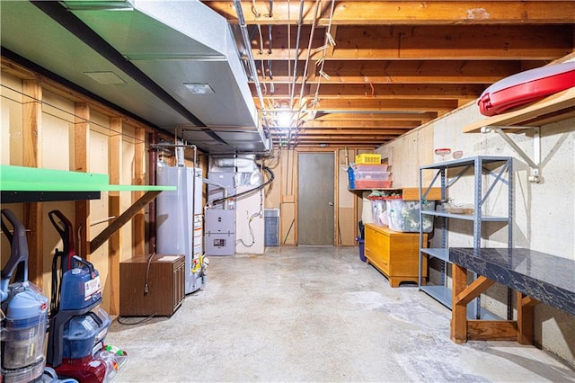 basement featuring gas water heater and heating unit