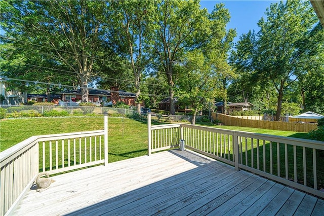 wooden deck with a lawn