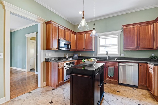 kitchen featuring crown molding, a kitchen island, light tile patterned flooring, and appliances with stainless steel finishes