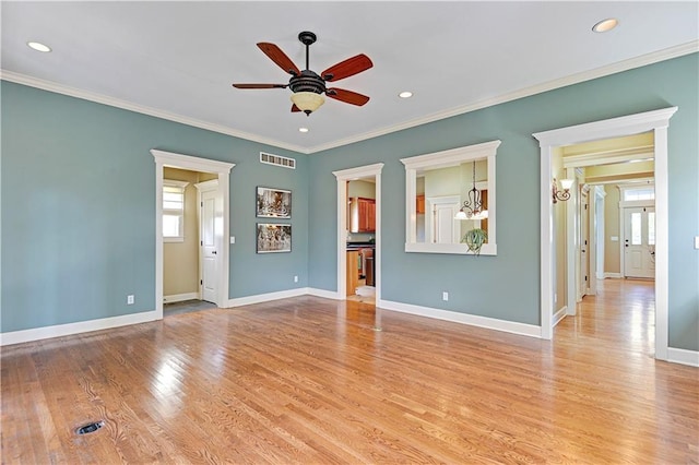 interior space with light hardwood / wood-style floors, ceiling fan with notable chandelier, and ornamental molding