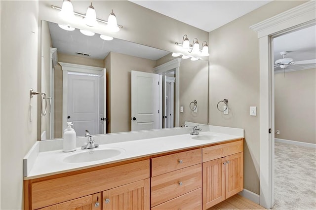 bathroom featuring vanity and ceiling fan