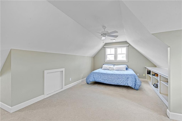 carpeted bedroom featuring ceiling fan and lofted ceiling