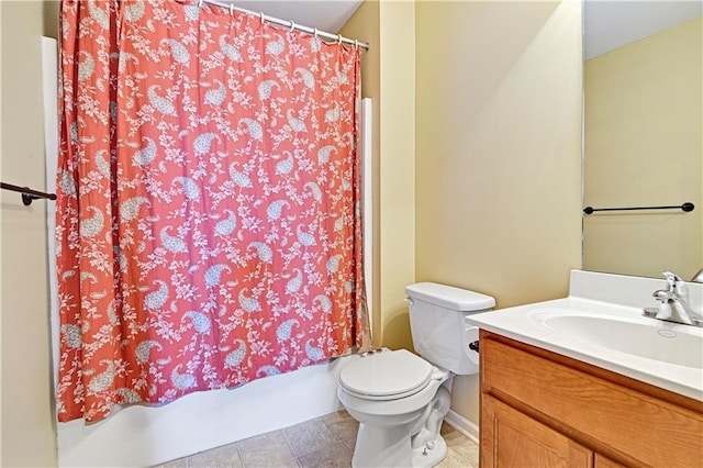 bathroom featuring tile patterned flooring, vanity, and toilet