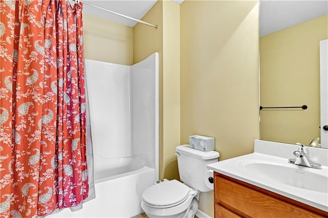 full bathroom featuring shower / bathtub combination with curtain, vanity, and toilet