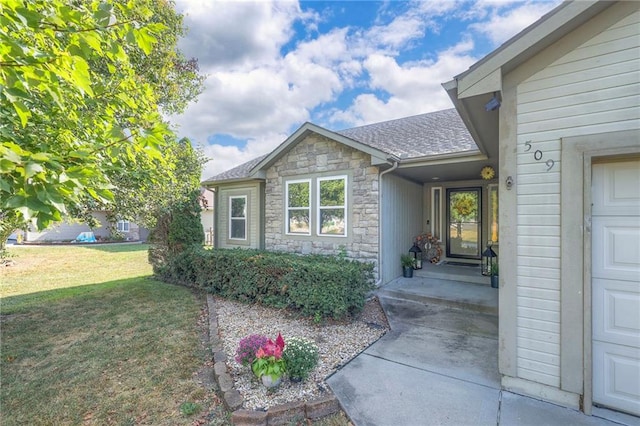 property entrance with a yard