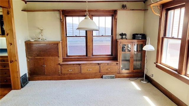 living room with plenty of natural light and carpet flooring