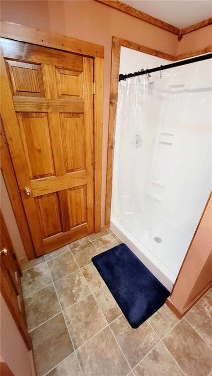 bathroom with a shower with shower curtain