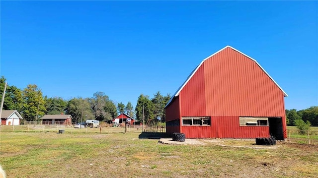 view of outbuilding with a lawn