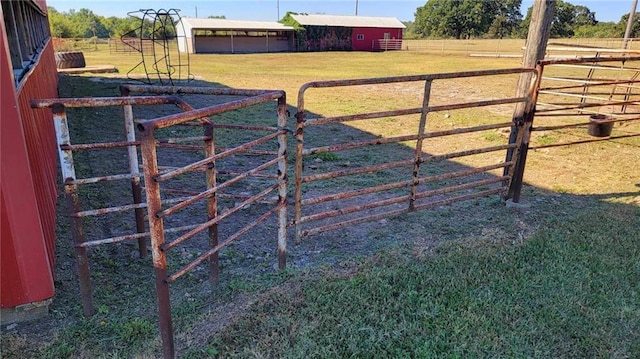 view of gate with an outbuilding