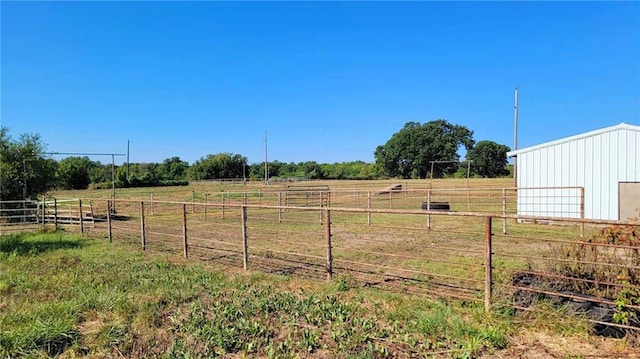 view of yard with a rural view