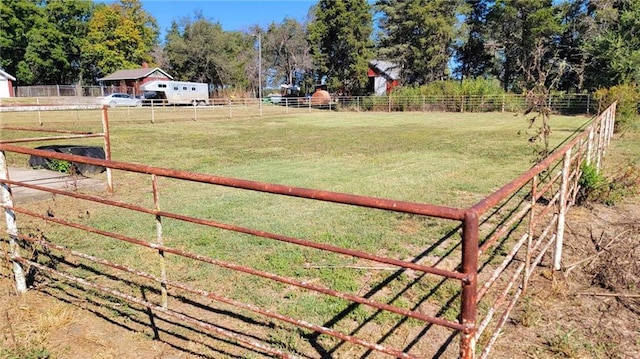 view of yard with a rural view