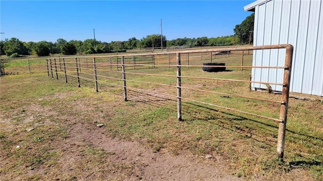 view of yard with a rural view