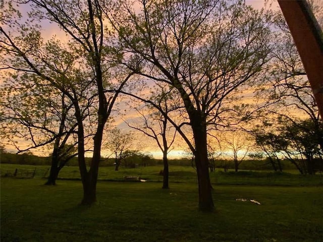 view of property's community featuring a yard