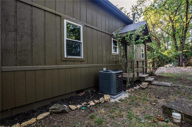 view of side of property with central AC unit