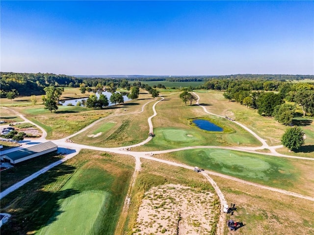 bird's eye view featuring golf course view and a water view