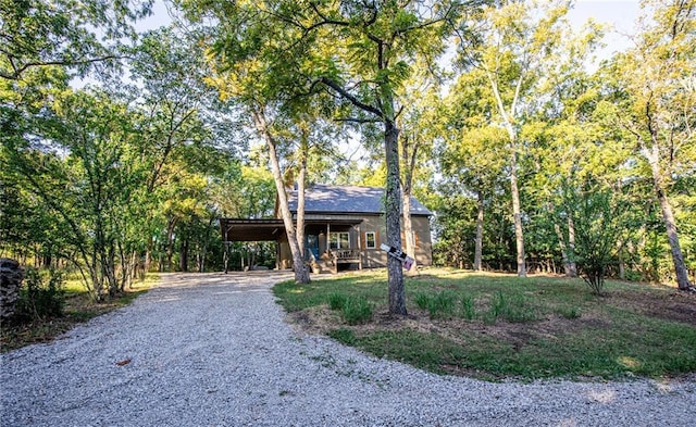 view of front of property with an attached carport and driveway