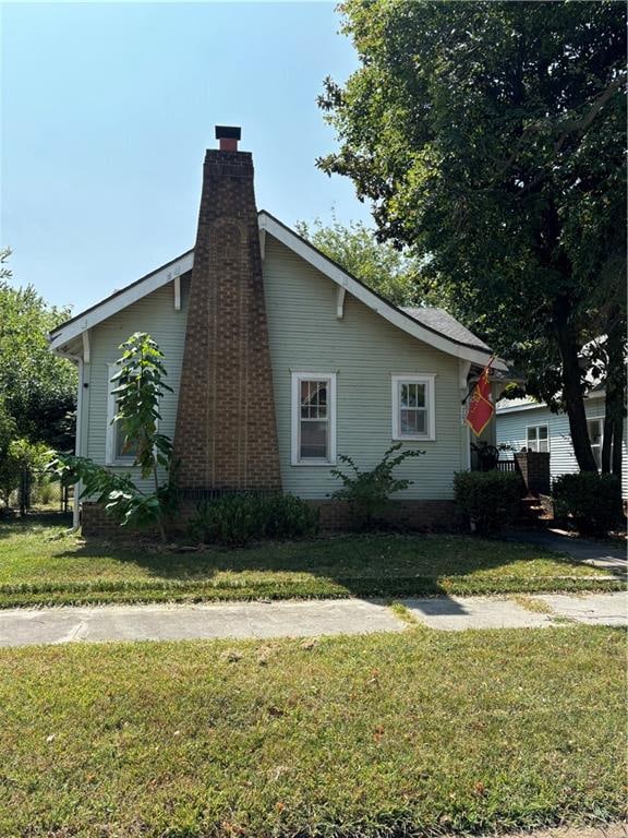 view of home's exterior featuring a yard