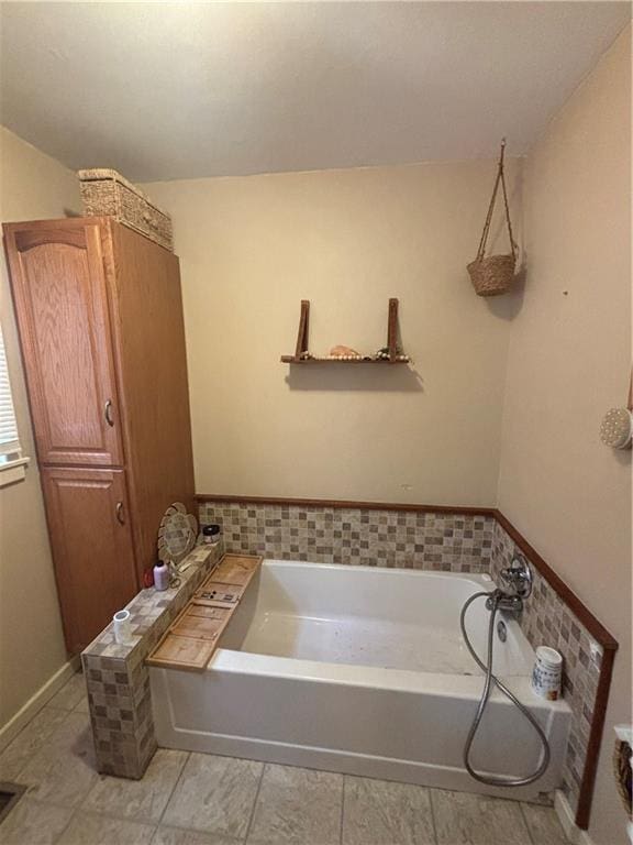 bathroom featuring a tub to relax in