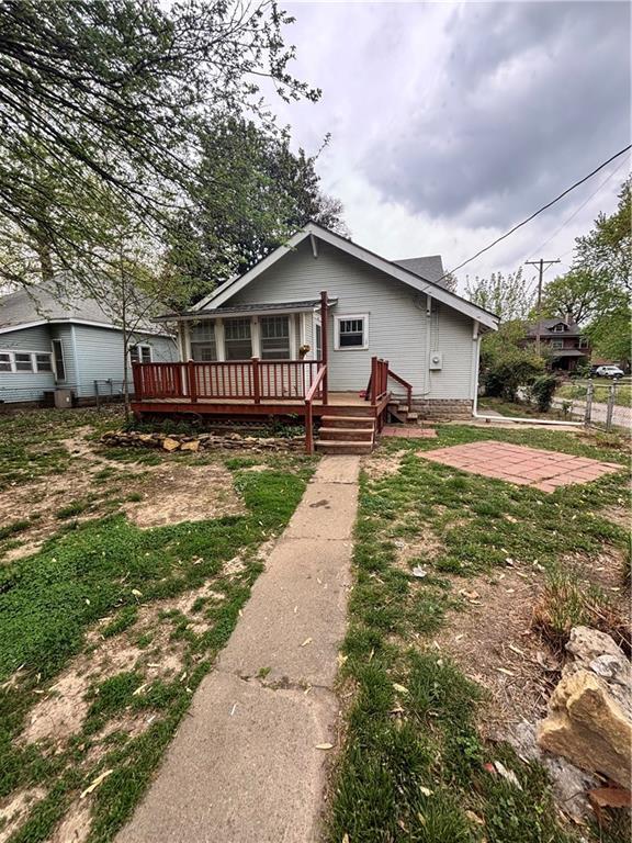 bungalow-style home with a deck