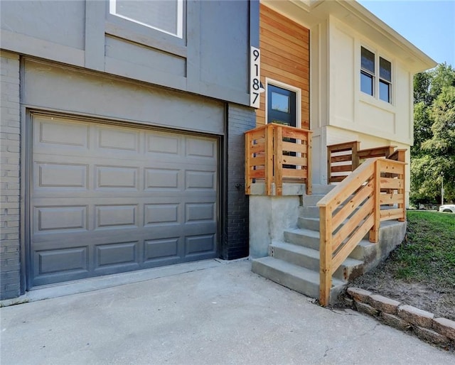 doorway to property featuring a garage