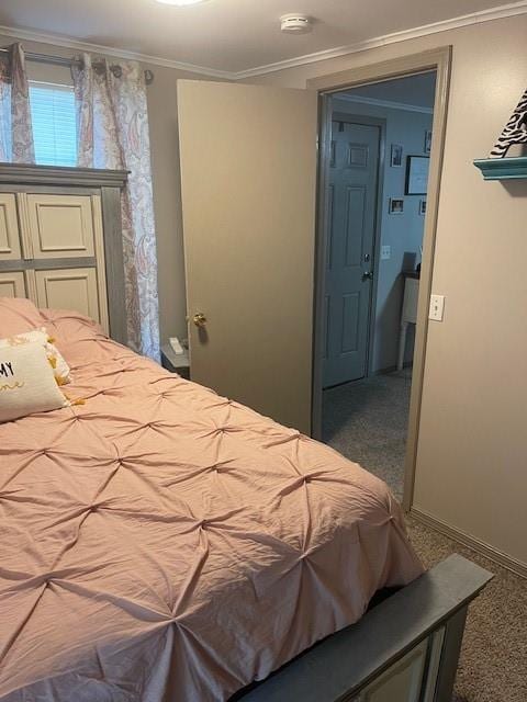 bedroom featuring carpet flooring and ornamental molding