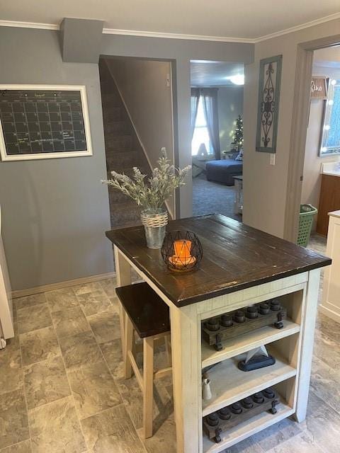 dining room featuring crown molding