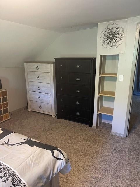 bedroom with vaulted ceiling and carpet floors